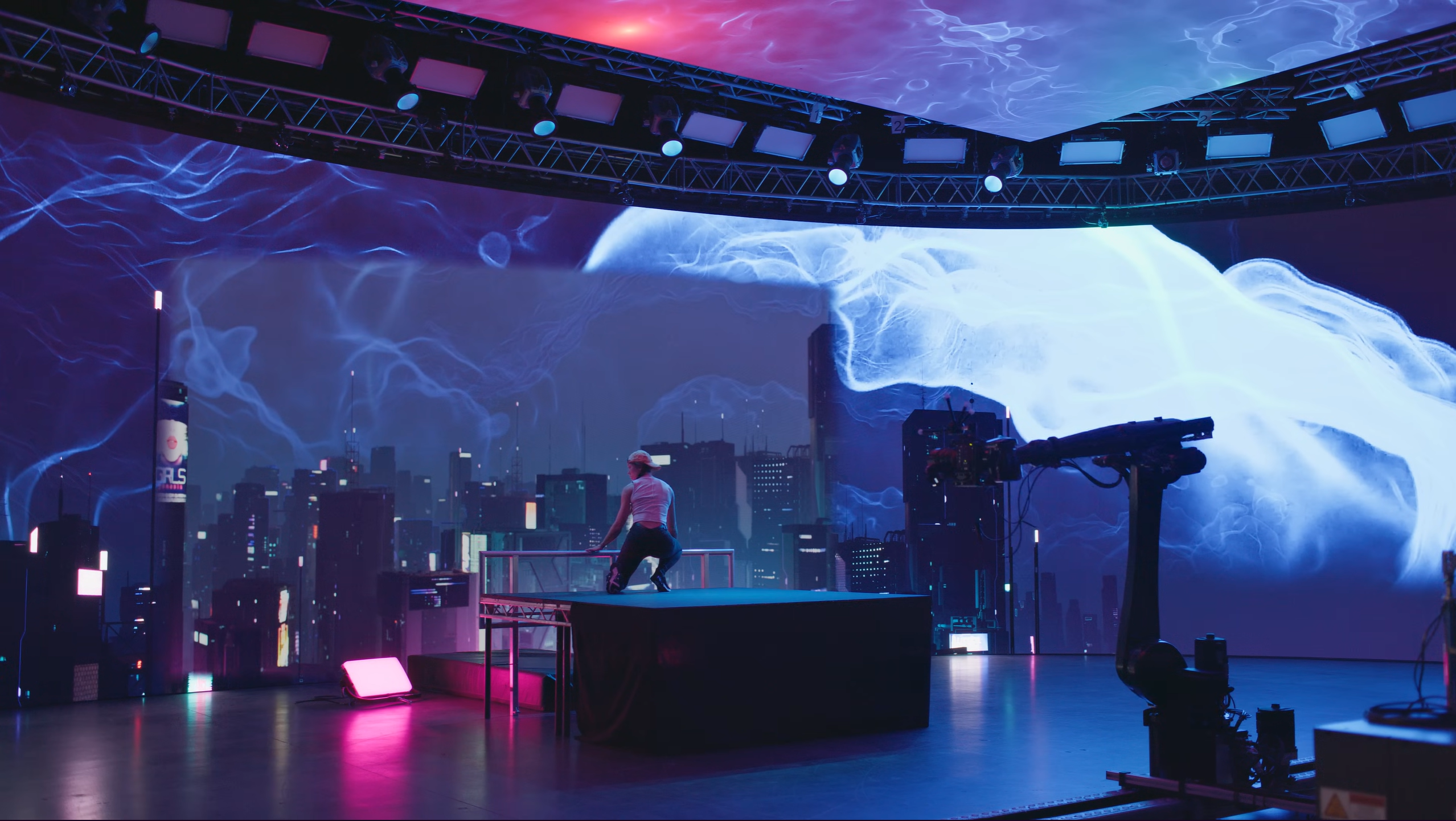 On-stage — performer in front of the cityscape on the LED wall
